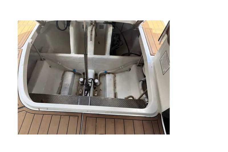 Slide: The Image of Engine compartment of a 1999 Formula 400 Super Sport boat, showcasing interior details. - 17