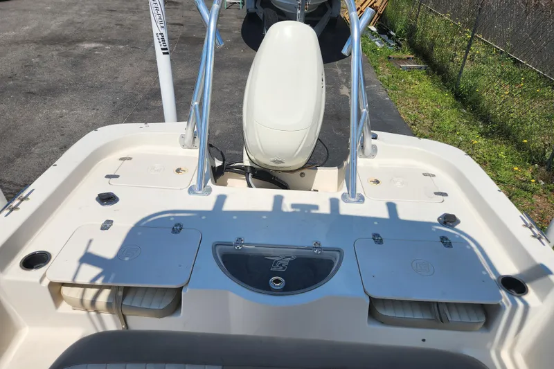 Slide: The Image of 2019 Carolina Skiff 218 DLV boat deck with seating and storage compartments. - 10