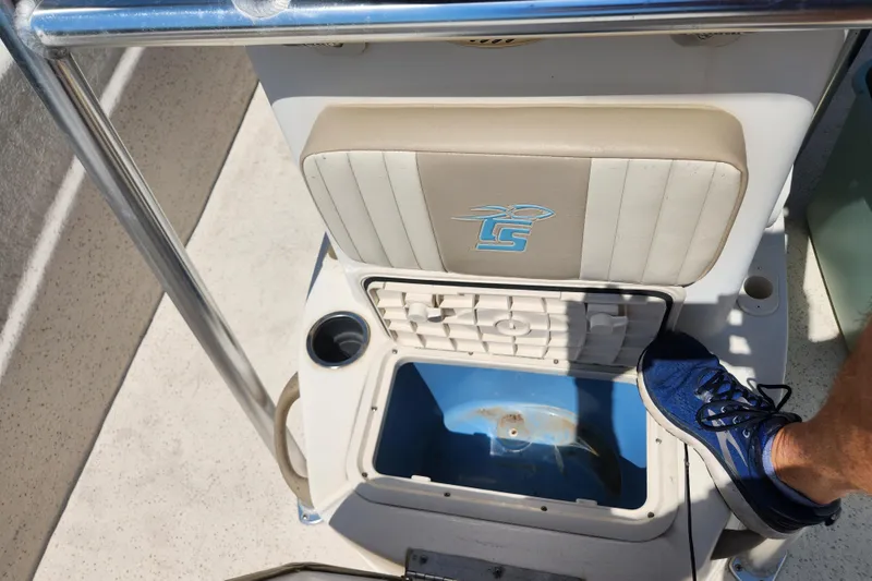 Slide: The Image of 2019 Carolina Skiff 218 DLV boat seat with storage compartment and cup holder. - 12