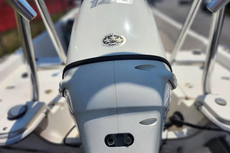 Slide: The Image of Close-up of a 2019 Carolina Skiff 218 DLV boat motor with ultra-low emission label. - 15