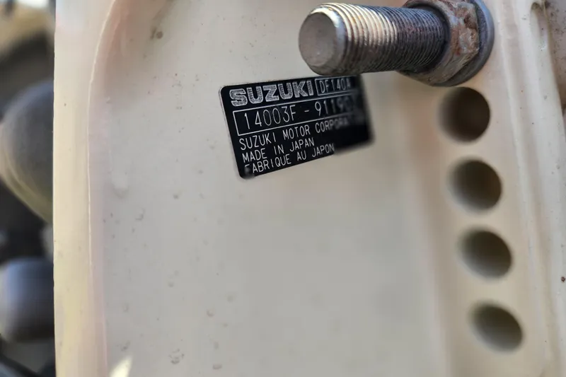 Slide: The Image of Close-up of Suzuki motor label on 2019 Carolina Skiff 218 DLV boat. - 16