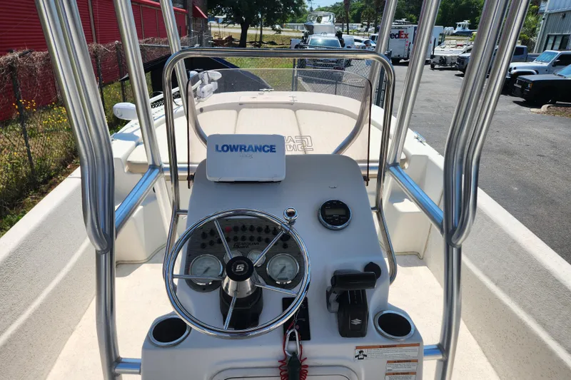 Slide: The Image of 2019 Carolina Skiff 218 DLV boat console with steering wheel and Lowrance device. - 6