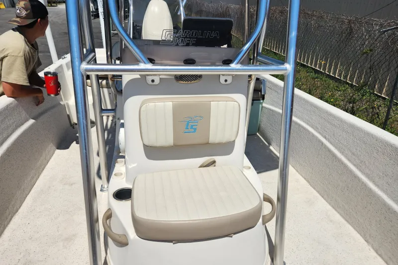 Slide: The Image of 2019 Carolina Skiff 218 DLV boat interior with seating and console. - 8