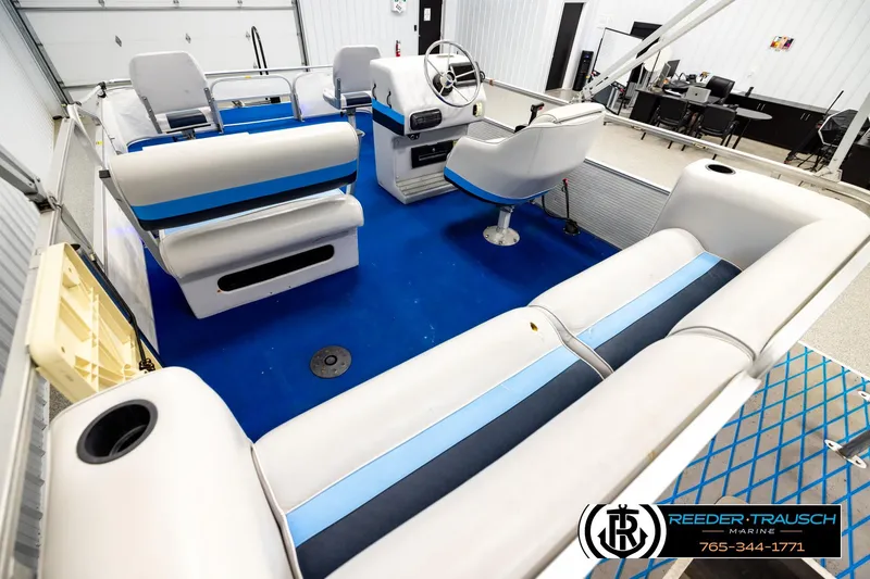 Slide: The Image of Interior of a 1994 Hydra 192-23 boat with blue and white seating. - 11