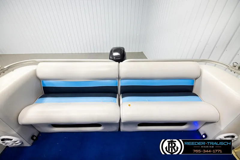Slide: The Image of Pontoon boat seating with blue accents, Hydra 192-23 model, 1994, by Reeder-Trausch Marine. - 15