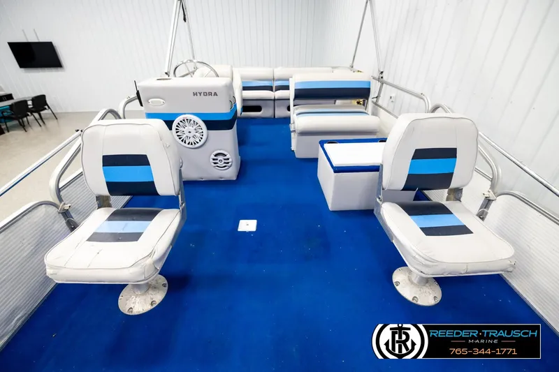 Slide: The Image of Interior of a 1994 Hydra 192-23 boat with blue and white seating. - 20