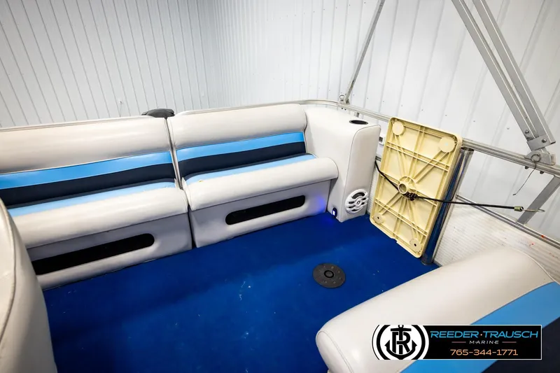 Slide: The Image of Interior of a 1994 Hydra 192-23 boat with blue and white seating. - 21