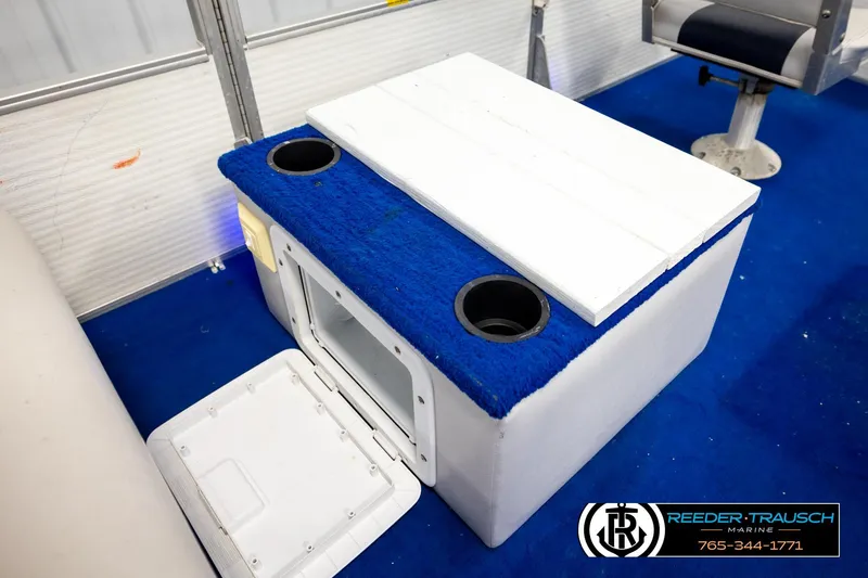 Slide: The Image of Boat interior with blue carpeted cooler, cup holders, and seating, Hydra 192-23, 1994 model. - 27