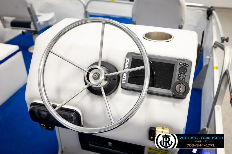 Slide: The Image of Steering console of a 1994 Hydra 192-23 boat with navigation equipment. - 28