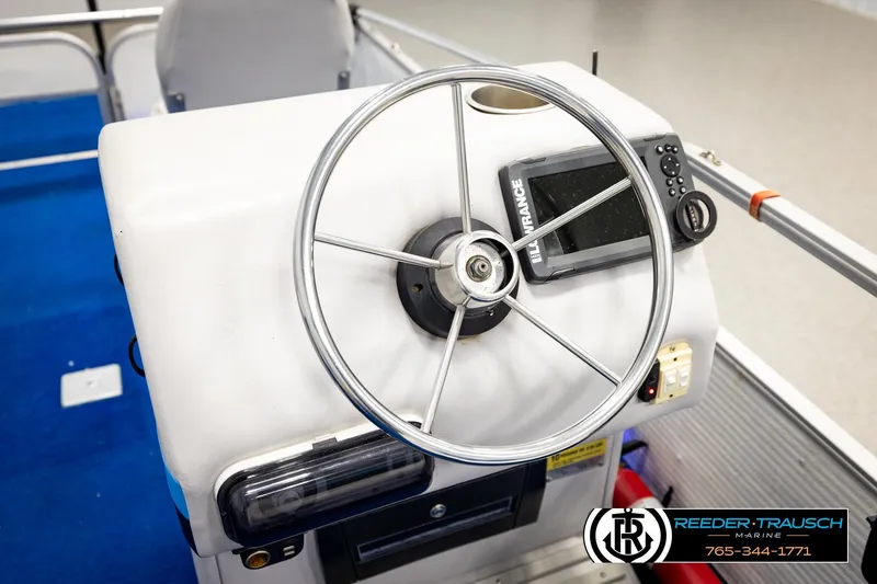 Slide: The Image of Steering console of a 1994 Hydra 192-23 boat with navigation equipment. - 29