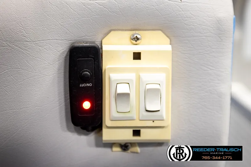 Slide: The Image of Switch panel with on/off button and red indicator light on Hydra 192-23, 1994 model. - 32