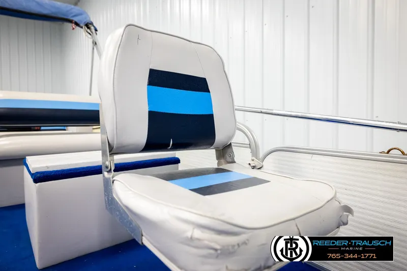 Slide: The Image of Boat seat with blue accents, Hydra 192-23 model, 1994, in a marine setting. - 36