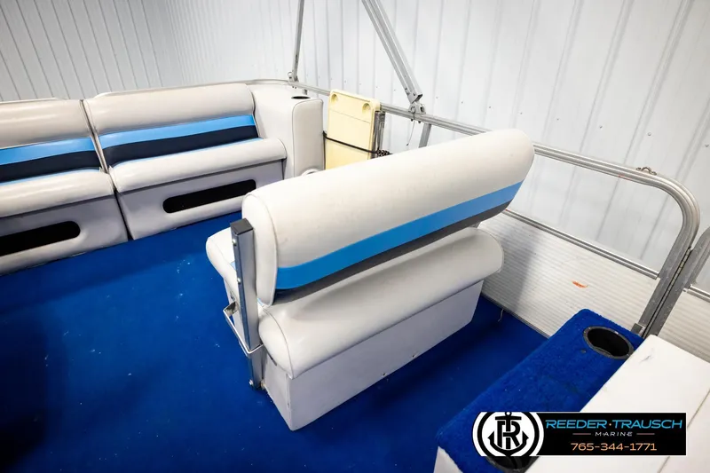 Slide: The Image of Interior of a 1994 Hydra 192-23 boat with blue and white seating. - 38