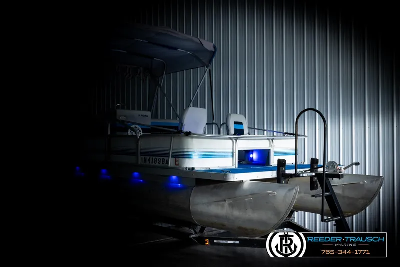 Slide: The Image of Pontoon boat in storage with blue lights, Hydra 192-23 model, 1994. - 4