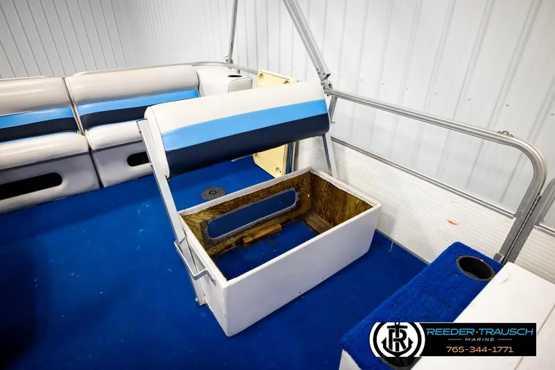 Slide: The Image of Interior of a 1994 Hydra 192-23 boat with blue and white seating. - 40