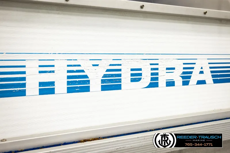 Slide: The Image of 1994 Hydra 192-23 boat with blue and white branding, Reeder-Trausch Marine logo visible. - 49