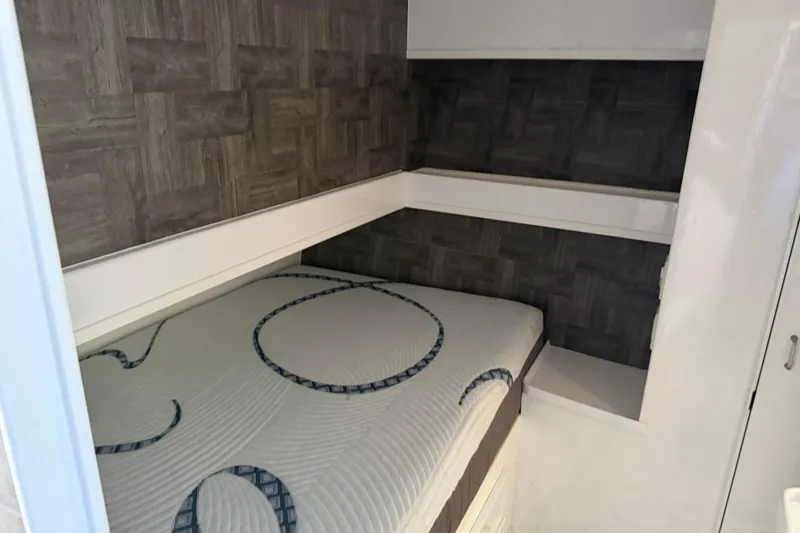 Slide: The Image of Cozy cabin interior of 1984 Ocean Yachts 55 Super Sport with modern bedding. - 30