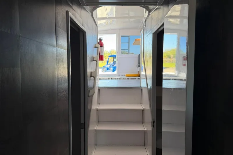 Slide: The Image of Interior view of 1984 Ocean Yachts 55 Super Sport, featuring stairs and cabin doors. - 34