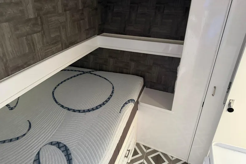 Slide: The Image of Interior cabin of 1984 Ocean Yachts 55 Super Sport with bed and storage. - 36