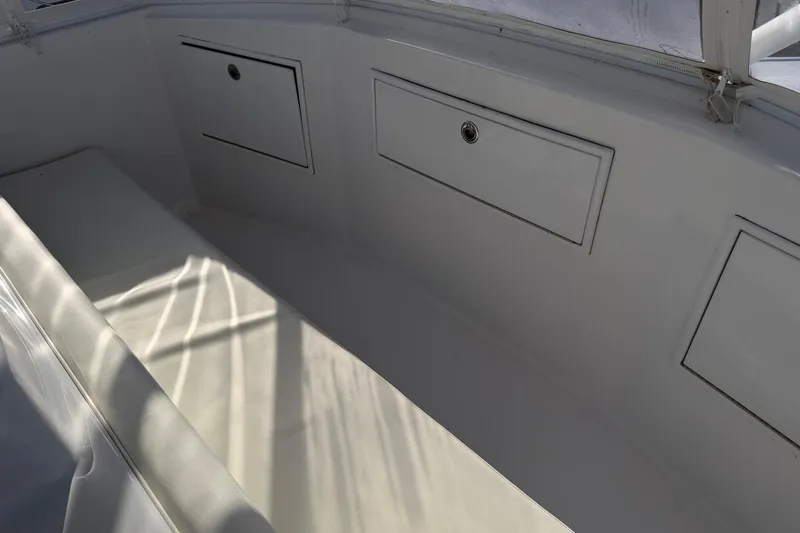 Slide: The Image of 1984 Ocean Yachts 55 Super Sport interior with storage compartments and seating. - 39