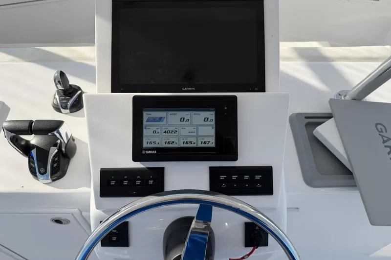 Slide: The Image of Control panel of a 1984 Ocean Yachts 55 Super Sport with Garmin and Yamaha displays. - 41