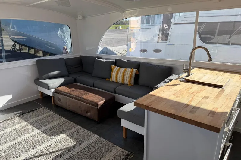 Slide: The Image of Interior of 1984 Ocean Yachts 55 Super Sport with cozy seating and kitchenette. - 43