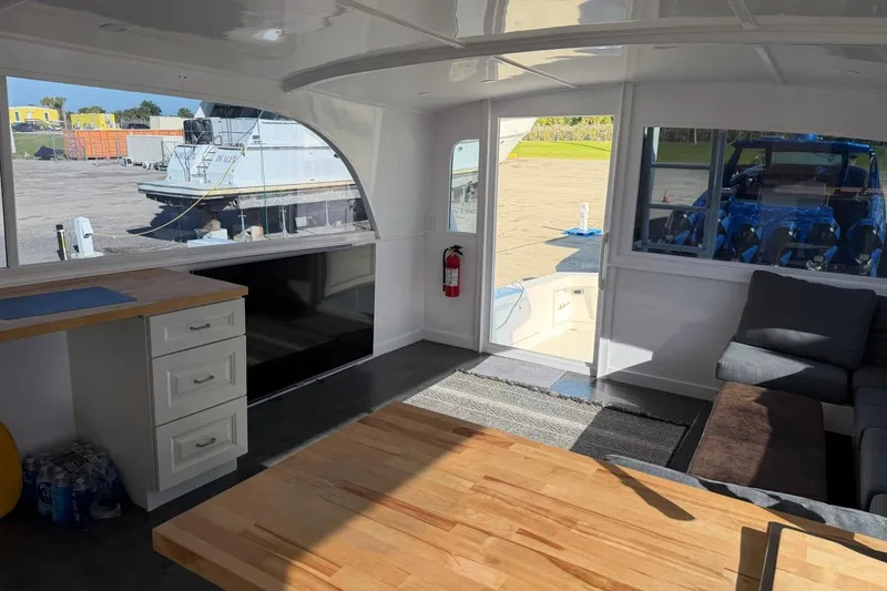 Slide: The Image of Interior of 1984 Ocean Yachts 55 Super Sport with modern furnishings and large windows. - 44