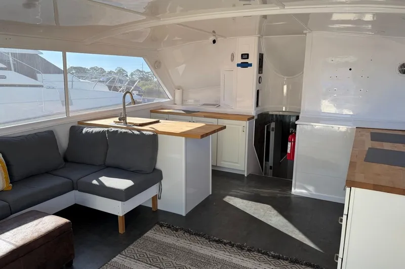 Slide: The Image of Interior of 1984 Ocean Yachts 55 Super Sport with modern kitchen and seating area. - 45