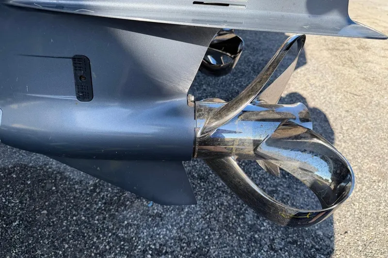 Slide: The Image of Close-up of a 1984 Ocean Yachts 55 Super Sport propeller on a textured surface. - 58