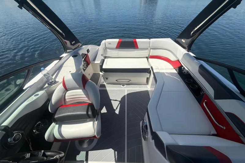 Slide: The Image of 2017 Regal 24 FasDeck boat interior with stylish seating and modern design on water. - 5