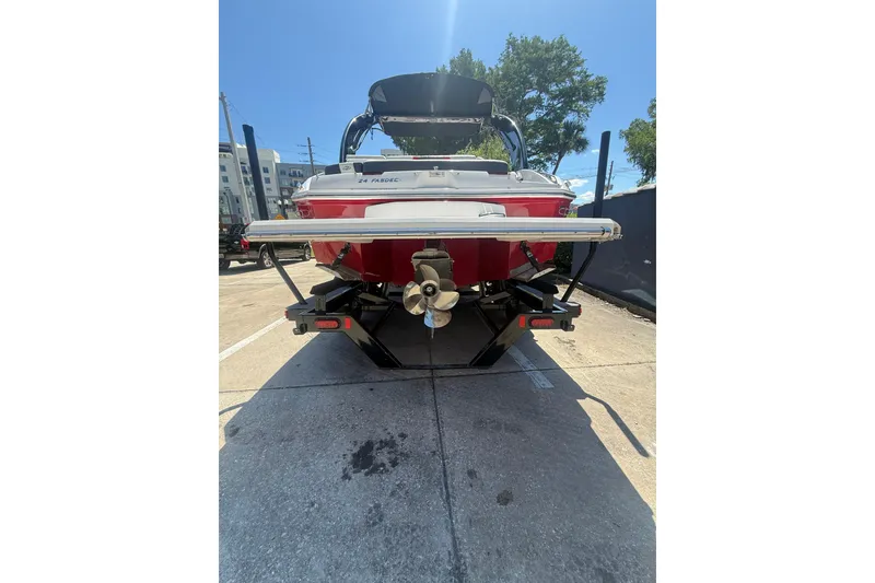 Slide: The Image of 2017 Regal 24 FasDeck boat, rear view, parked on concrete, sunny day. - 9