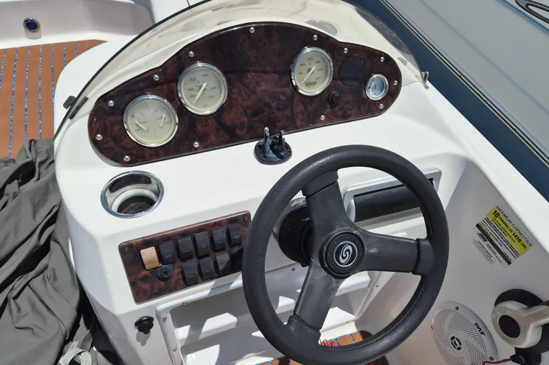 Slide: The Image of Steering console of a 2013 Hurricane FunDeck 226 boat with gauges and controls. - 10