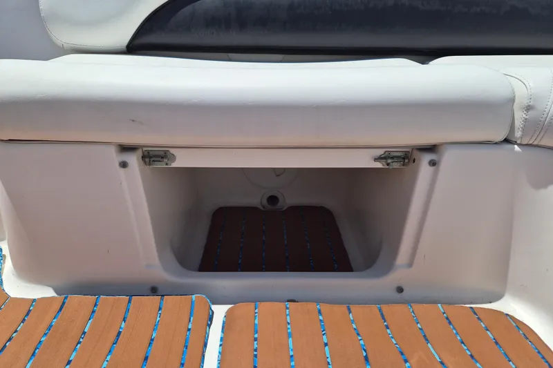 Slide: The Image of 2013 Hurricane FunDeck 226 boat storage compartment with cushioned seating. - 12