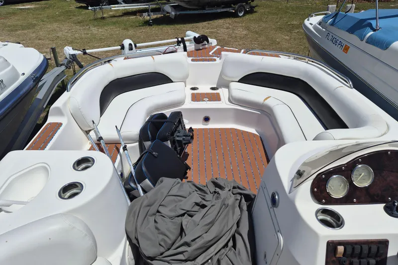 Slide: The Image of 2013 Hurricane FunDeck 226 boat interior with seating and dashboard. - 13