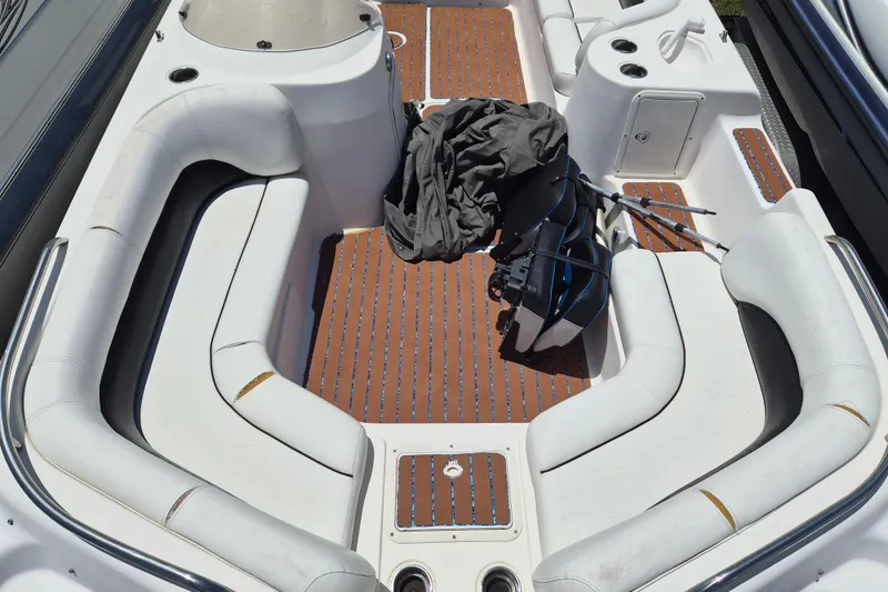 Slide: The Image of 2013 Hurricane FunDeck 226 boat interior with white seating and wooden flooring. - 20