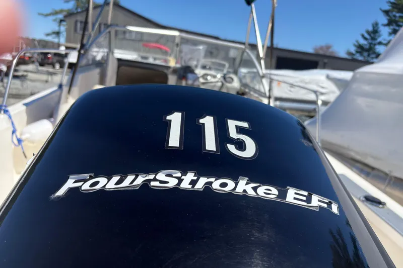 Slide: The Image of Outboard motor on 2004 Trophy 1802 Walkaround boat, featuring FourStroke EFI technology. - 5