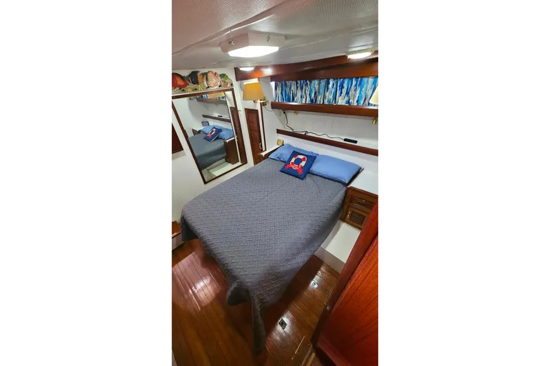 Slide: The Image of Cozy bedroom in 1981 Sea Ranger 47 Pilothouse yacht with nautical decor. - 18