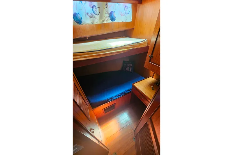 Slide: The Image of Cozy cabin interior of 1981 Sea Ranger 47 Pilothouse with wooden furnishings. - 21