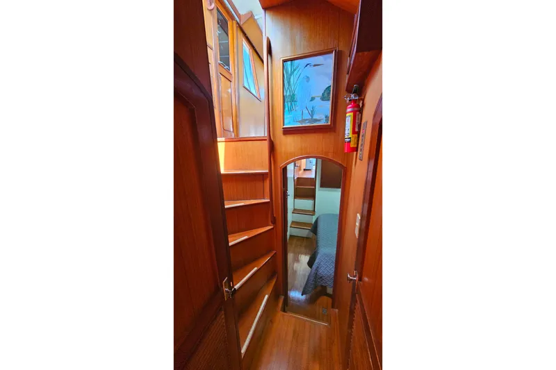 Slide: The Image of Interior of 1981 Sea Ranger 47 Pilothouse with wooden paneling and cozy cabin view. - 25