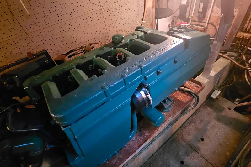 Slide: The Image of Engine room of 1981 Sea Ranger 47 Pilothouse with visible marine engine components. - 26