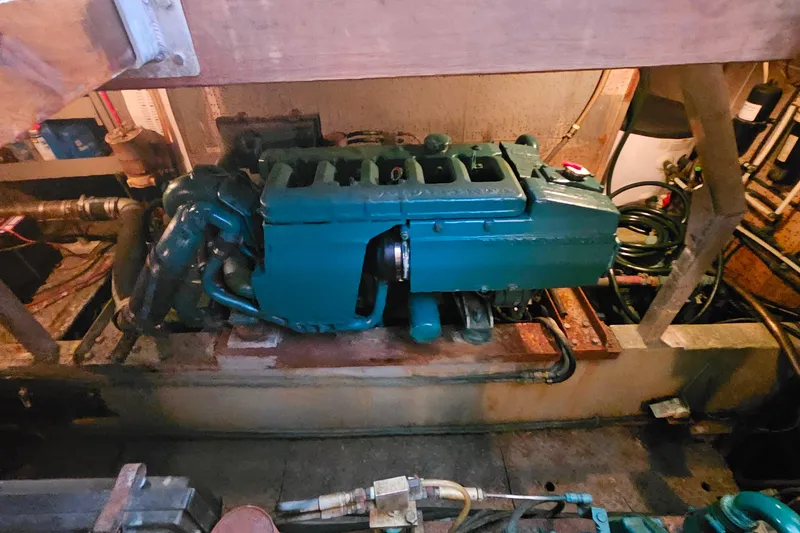 Slide: The Image of Engine room of a 1981 Sea Ranger 47 Pilothouse with visible machinery and components. - 28