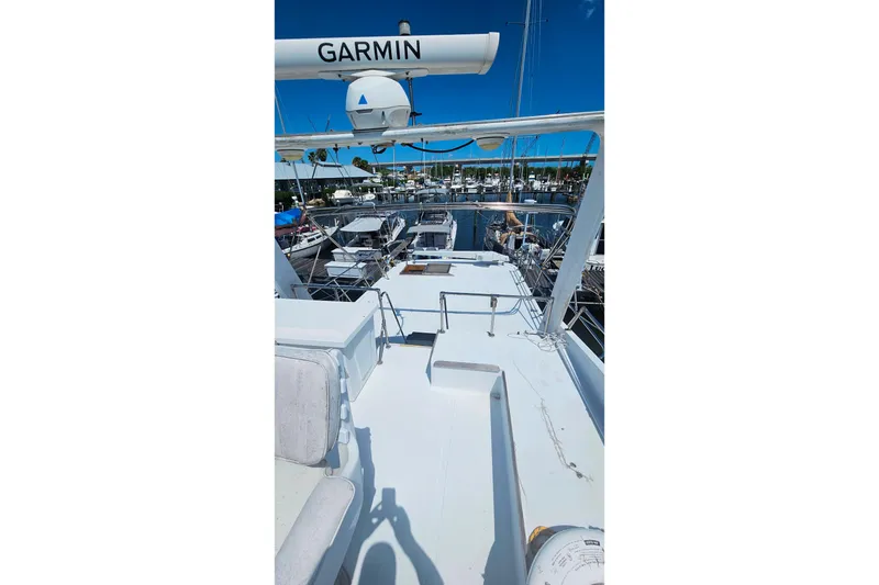 Slide: The Image of 1981 Sea Ranger 47 Pilothouse yacht deck with Garmin equipment, docked at marina. - 35
