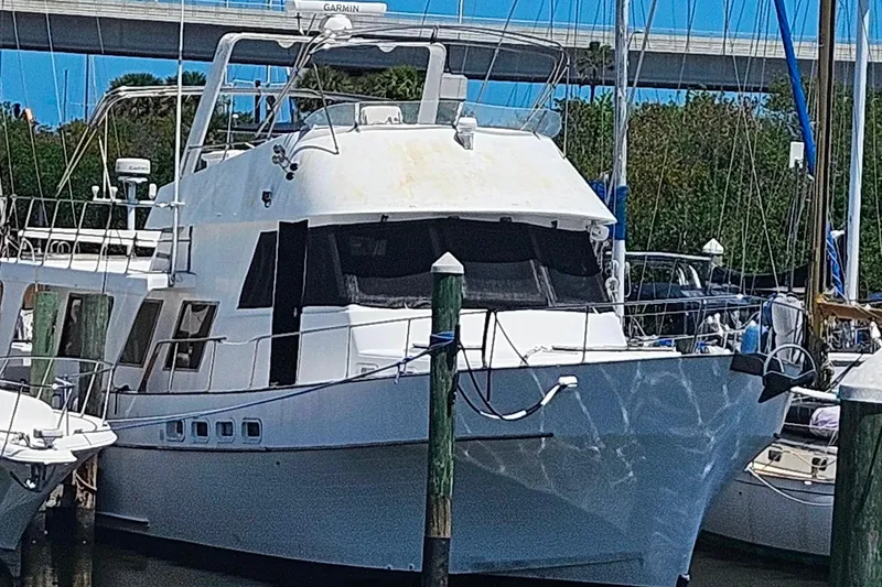 Slide: The Image of 1981 Sea Ranger 47 Pilothouse docked, surrounded by other boats. - 43