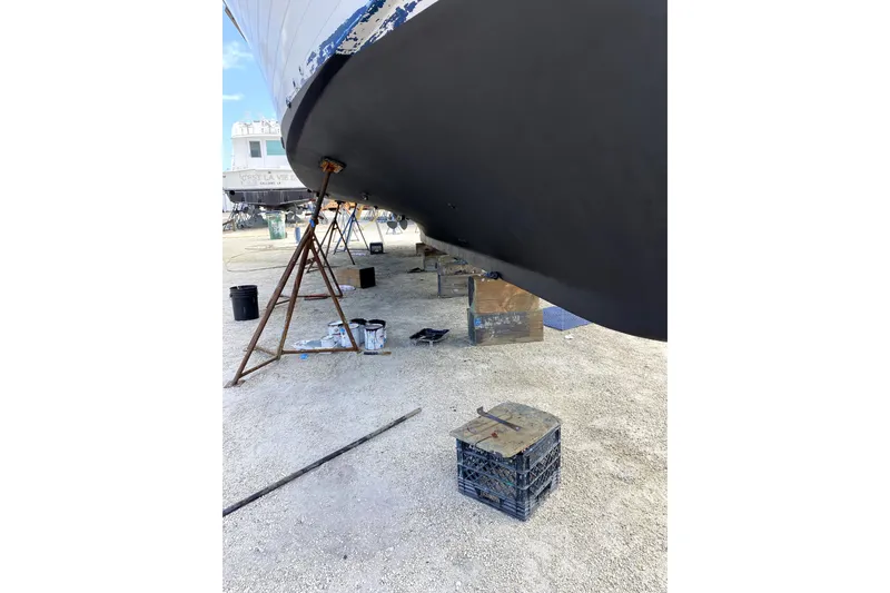 Slide: The Image of 1981 Sea Ranger 47 Pilothouse undergoing maintenance with fresh hull paint. - 49
