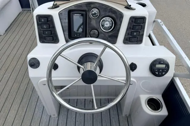 Slide: The Image of Steering console of 2019 Quest Adventure 818 boat with gauges and controls. - 3