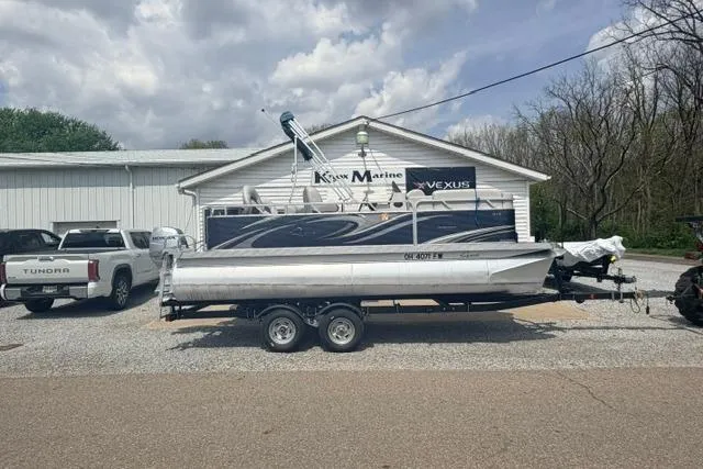 Slide: The Image of 2019 Quest Adventure 818 boat on trailer at Knox Marine dealership. - 5