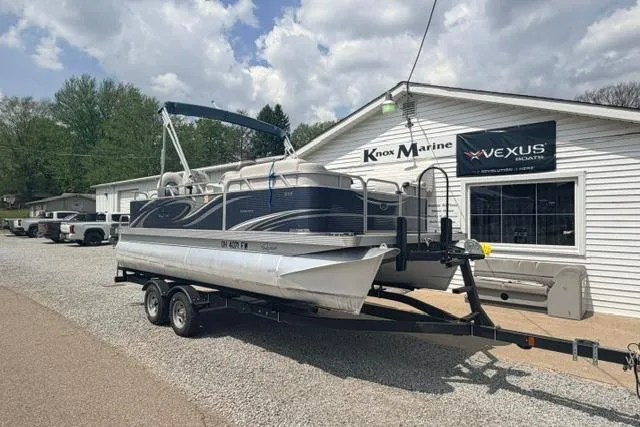 Slide: The Image of 2019 Quest Adventure 818 pontoon boat on trailer outside Knox Marine dealership. - 6