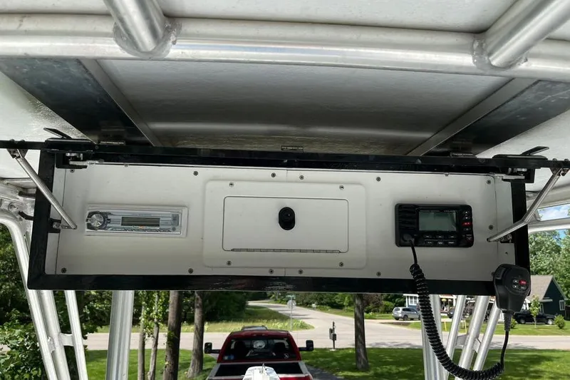 Slide: The Image of 1974 Boca Grande Passmaster 26 boat dashboard with radio and control panel. - 15