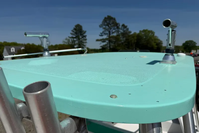 Slide: The Image of 1974 Boca Grande Passmaster 26 boat with teal deck and metal fixtures. - 16