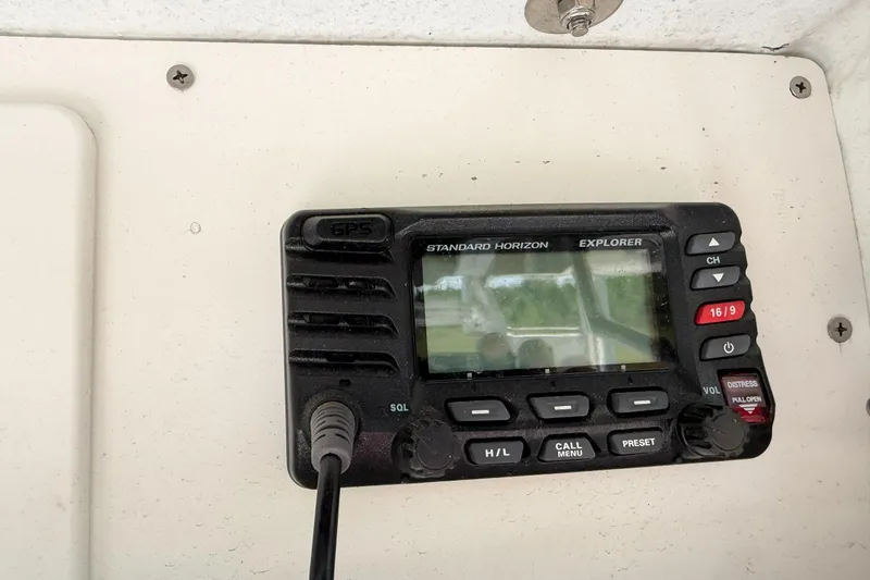 Slide: The Image of Standard Horizon Explorer radio on 1974 Boca Grande Passmaster 26 boat dashboard. - 17